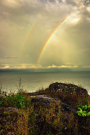 rainbow colorful above sea horizon at dawn image is taken at gokarna karnataka india. it is showing the colorful art of nature.の写真素材