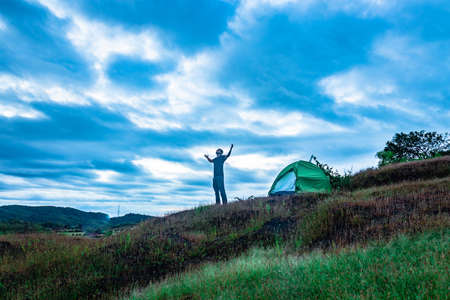 camping solo at mountain top with amazing view and dramatic sky at evening image is taken at gokarna karnataka india.の写真素材