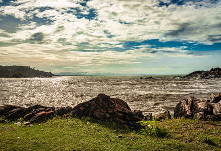 rocky sea beach with crashing waves at morning from flat angle image is taken at om beach gokarna karnataka india. it is one the best beach of gokarna.の写真素材