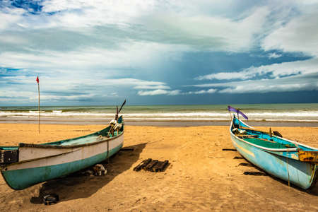 sea shore with boats and amazing sky at morning from flat angle image is taken at gokarna beach karnataka india.の写真素材
