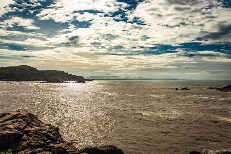 rocky sea beach with crashing waves at morning from flat angle image is taken at om beach gokarna karnataka india. it is one the best beach of gokarna.の写真素材
