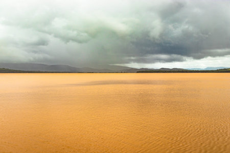 pristine landscape with lake calm water and dramatic sky at morning from flat angle image is taken...