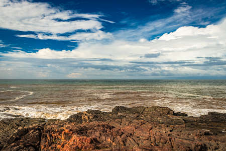 rocky sea beach with crashing waves at morning from flat angle image is taken at om beach gokarna karnataka india. it is one the best beach of gokarna.の写真素材