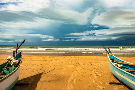 sea shore with boats and amazing sky at morning from flat angle image is taken at gokarna beach karnataka india.の写真素材