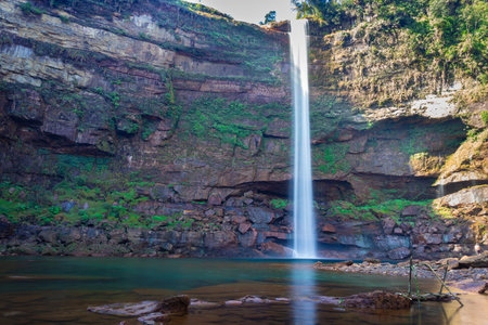 waterfall falling streams from mountain top with reflection from different perspective image taken on phe phe fall meghalaya india. it is one of the tallest waterfall of meghalaya.の写真素材