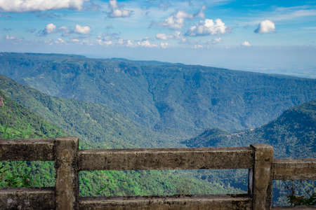 mountain range with bright blue sky at afternoon from flat angle image is taken at seven sister waterfall cherrapunji meghalaya india.の写真素材