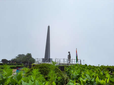 war memorial in the remembrance of brave soldiers at foggy day image is taken at batista loop darjeeling west bengal india.の写真素材