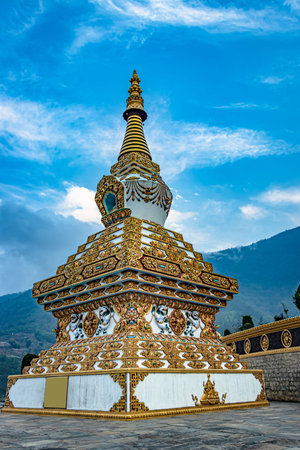 buddhist stupa with bright blue sky at morning from low angle image is taken at dirang monastery...