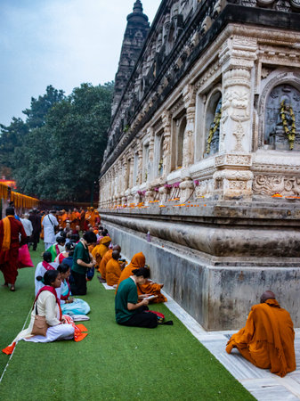 Buddhist monks are praying at temple at morning with concentration image is taken at mahabodhi temple bodh gaya bihar india on 15 Mar 2020. it is the enlightened place of Grate budha.のeditorial素材
