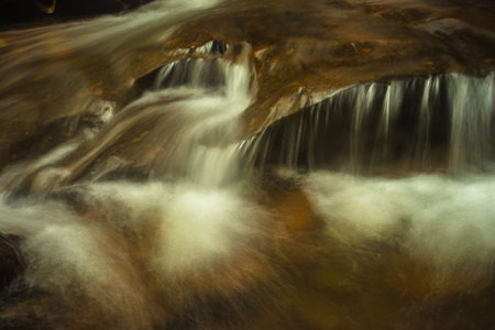waterfall with milky white water flow long exposure flat angle image