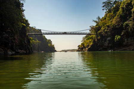 lake transparent water surrendered with mountain and forest image is taken at dwaki lake meghalaya india.の写真素材