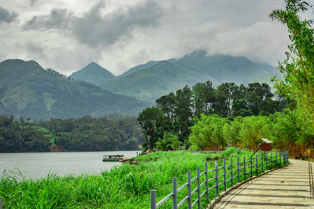 lake serene with beautiful hiking trails and mountain background image is taken at banasura sagar...