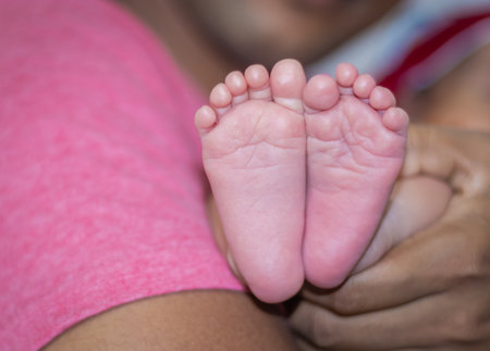 newborn little baby soft tender feet from flat angleの写真素材