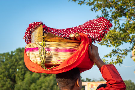 devotee carrying offerings for sun god during Chhath festival from flat angleのeditorial素材