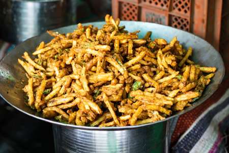 potato finger fries deep fried in oil kept at shop for sale at dayの写真素材
