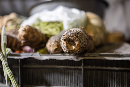 fresh yam vegetable at vegetable store fro sale with shallow depth of field and blurred backgroundの写真素材