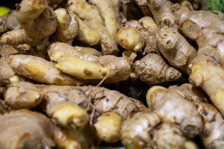 fresh ginger at vegetable store for sale at eveningの写真素材