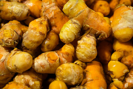 raw turmeric vegetables at vegetable store for sale at eveningの写真素材