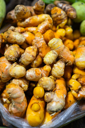 raw turmeric vegetables at vegetable store for sale at eveningの写真素材