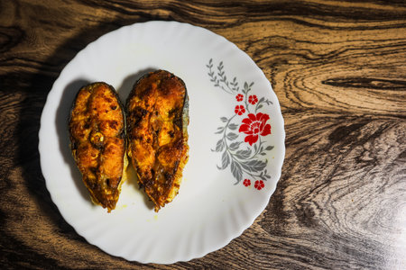 isolate fried fish kept at white plat at home from different angleの写真素材