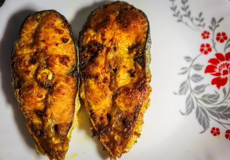 isolate fried fish kept at white plat at home from different angleの写真素材