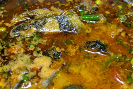 fresh cooked boiling fish gravy at cauldron at home at dayの写真素材