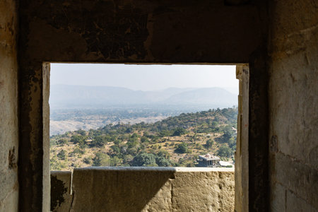 fort view of misty mountain range covered with fog at morning from flat angle image is taken at Kumbhal fort kumbhalgarh rajasthan india.の写真素材