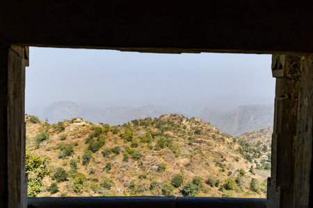 fort view of misty mountain range covered with fog at morning from flat angle image is taken at Kumbhal fort kumbhalgarh rajasthan india.の写真素材