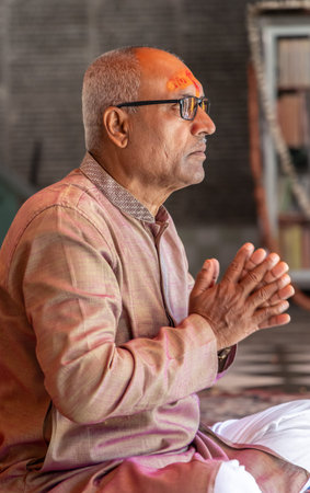 devotee praying for holy god at temple at morning from flat angle
