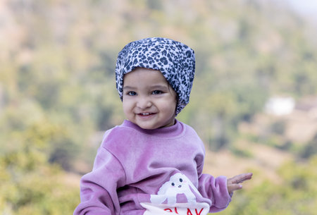 innocent child cute facial expression at outdoors at morning from flat angle
