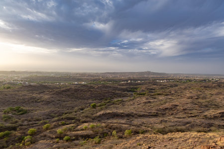 dry mountain terrain with dramatic blue sky at evening from flat angle image is taken at mehrangarh...