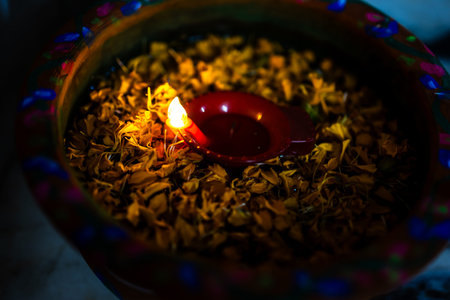 artistic diwali decoration at home stairs with flower pot and electric candle