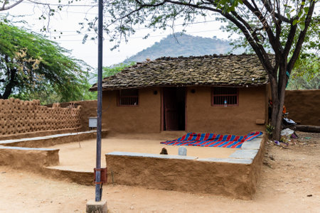 rural tribe traditional home made of twigs and mud at village at dayの写真素材