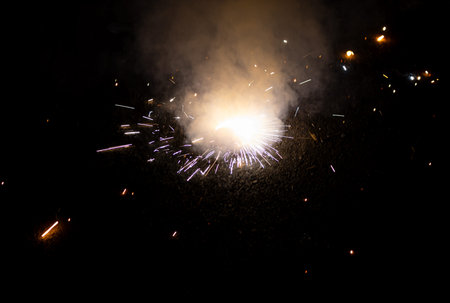 Ground spinner or indian Chakhri fireworks during the Diwali festival celebration at night