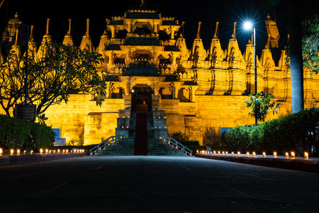 illuminated ancient unique temple architecture at night from different angle image is taken at ranakpur jain temple rajasthan india.の写真素材