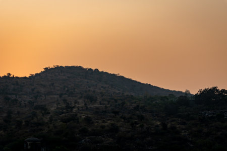 mountain with orange sunset sky at morning from flat angleの写真素材