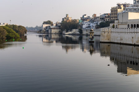 Tranquil Waterfront View of Udaipur Cityscape with Historic Architecture and Reflections image is taken at Udaipur rajasthan india.の写真素材