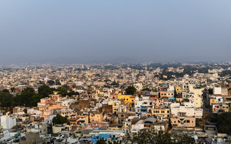 crowded city view from mountain top at morning from flat angle image is taken at city palace, Udaipur rajasthan india.の写真素材