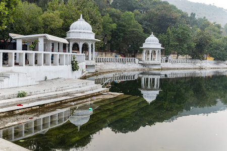 artistic city architecture with clam lake water reflection at morning image is taken at Udaipur...
