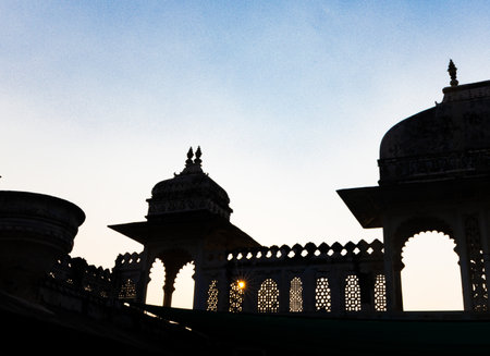 backlit shot of palace exterior with bright blue sky at morningの写真素材