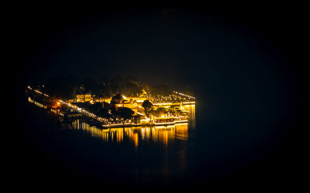 night view of lake city with with dramatic lighting from unique perspective image is taken at...