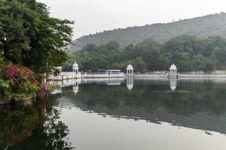 artistic city architecture with clam lake water reflection at morning image is taken at Udaipur rajasthan india.の写真素材