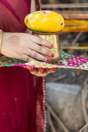 devotee holding holy offerings for worshiping of god at day on the occasion of Banyan tree worship festival, (Vat Savitri Puja) India.の写真素材