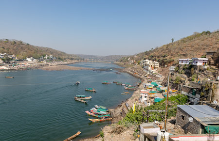 pristine river with tourist ferry boats at morning aerial view image is taken at omkareshwar khandwa madhya pradesh india.の写真素材