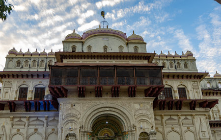 Sacred Hindu temple with its vibrant architecture and dramatic sky at evening