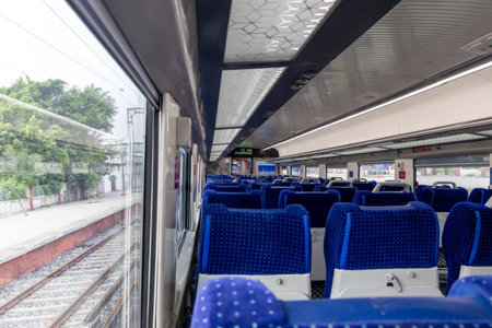 Passenger Coaches with Vacant Seat and Window View During Daytime of high speed Train image is taken...