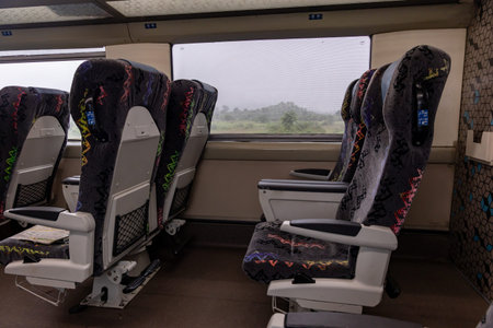 Vacant Passenger Train Seat with Window View During Daytime image is taken of vande bharat or indian...