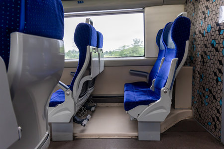 Vacant Passenger Train Seat with Window View in Motion During Daytime image is taken of vande bharat or indian railway train at Abu road station rajasthan india.の写真素材