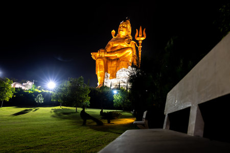 Isolated Statue of Hindu Lord Shiva in Meditation Posture with black dark sky at nightの写真素材