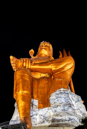 Isolated Statue of holy Hindu Lord Shiva in Meditation Posture with black dark sky at nightの写真素材